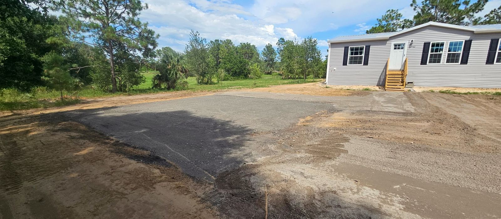 The same ground with a compacted asphalt millings pad rolled in and edged