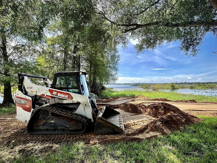 Track loader flattening a pad, Central Florida