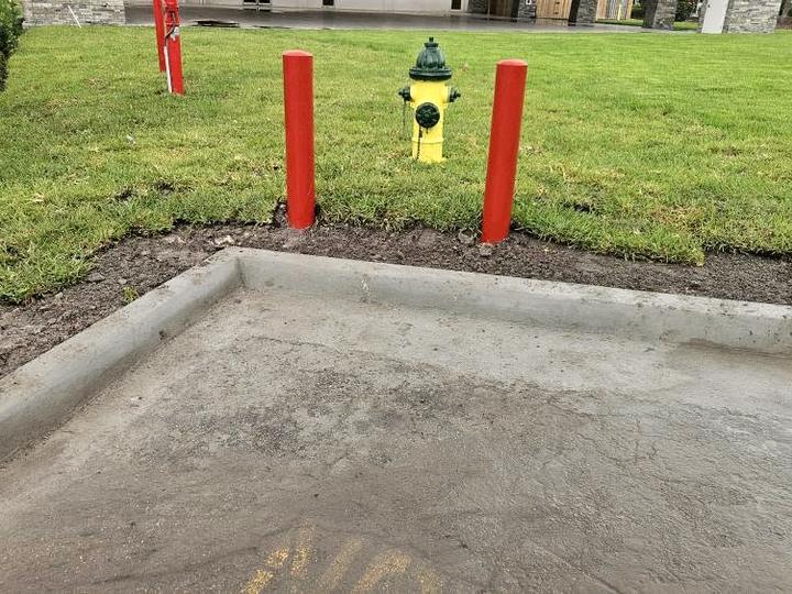 A new concrete pad with a formed curb