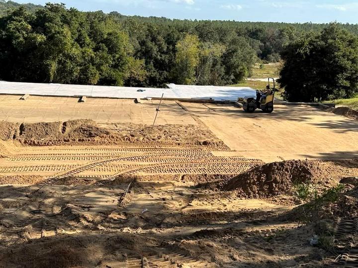 Pad with vapor barrier, roller working, Central Florida